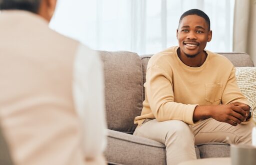 A patient and a psychiatrist who may be discussing an accelerated TMS protocol